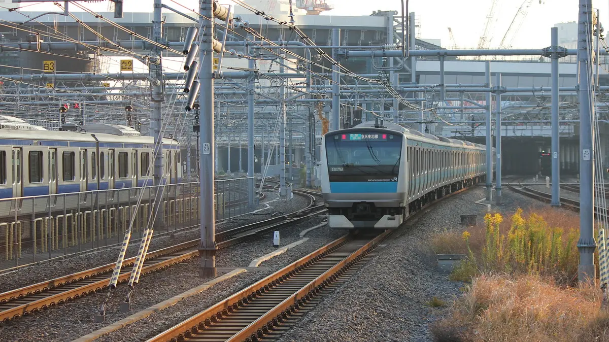 Keihin-Tohoku Line E233 series train heading from Takanawa Gateway Station to Shinagawa Station