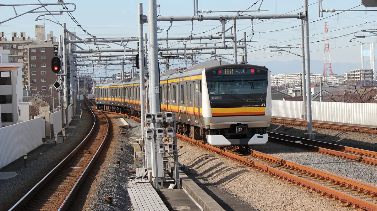 Nambu Line E233 series train departing from Inagi-Naganuma Station