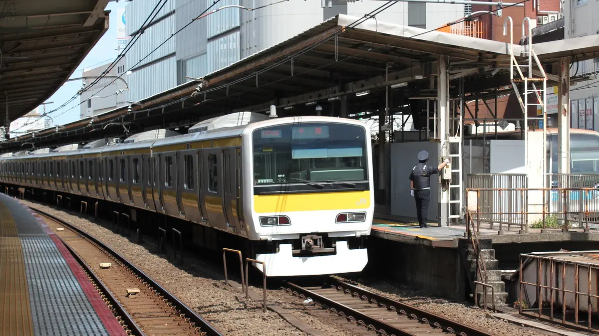 Sobu Line E231 series train stopping at Kichijoji Station