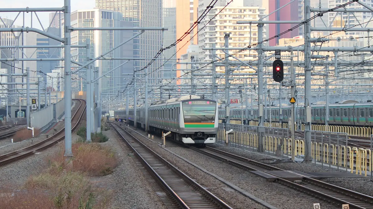 Tokaido Line E233 series 3000 train passing through Takanawa Gateway Station