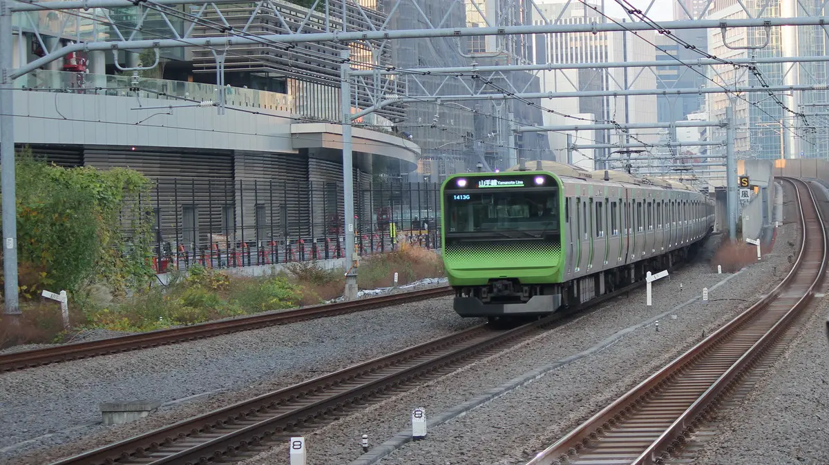 Yamanote Line E235 series train arriving at Takanawa Gateway Station
